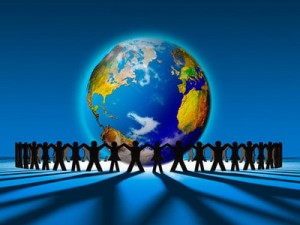 People holding hands around earth